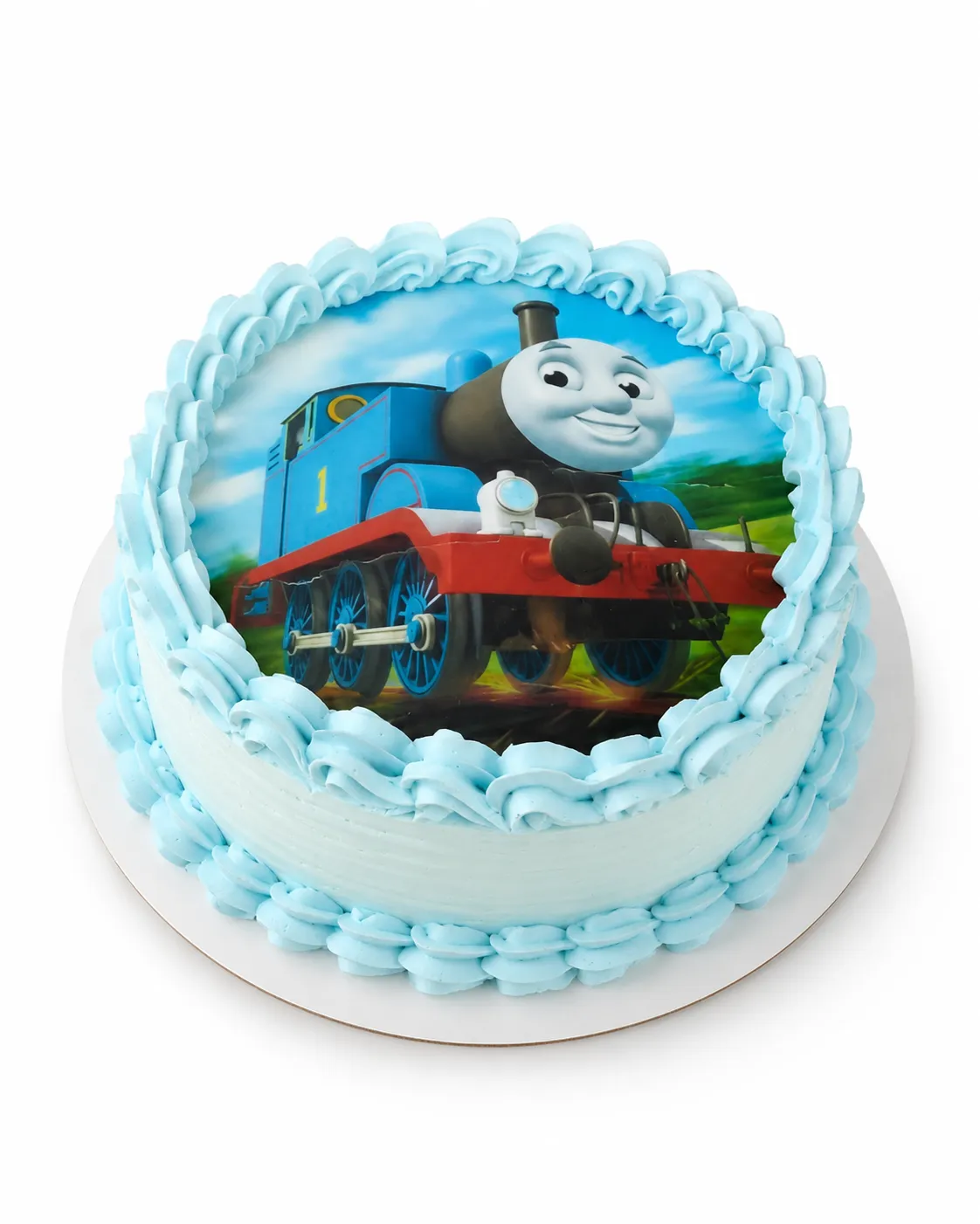 Torta con foto comestible de una locomotora azul de dibujitos y borde de merengue celeste.